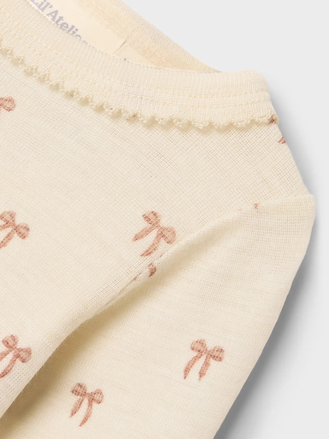 Lil Atelier | Strampler mit Nalu-Wollschleifen 
